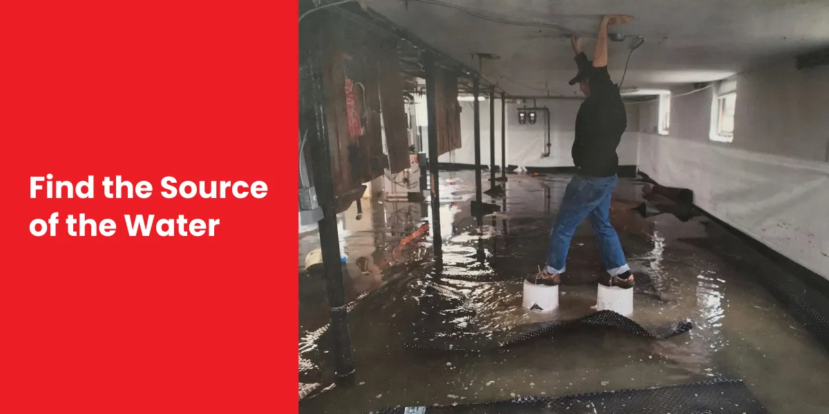 Find the Source of the Water A person standing on blocks in a waterlogged crawl space, inspecting the source of water damage.